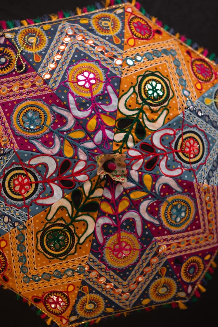 Ornate Indian embroidered parasol on display at Jewel of India Seattle restaurant